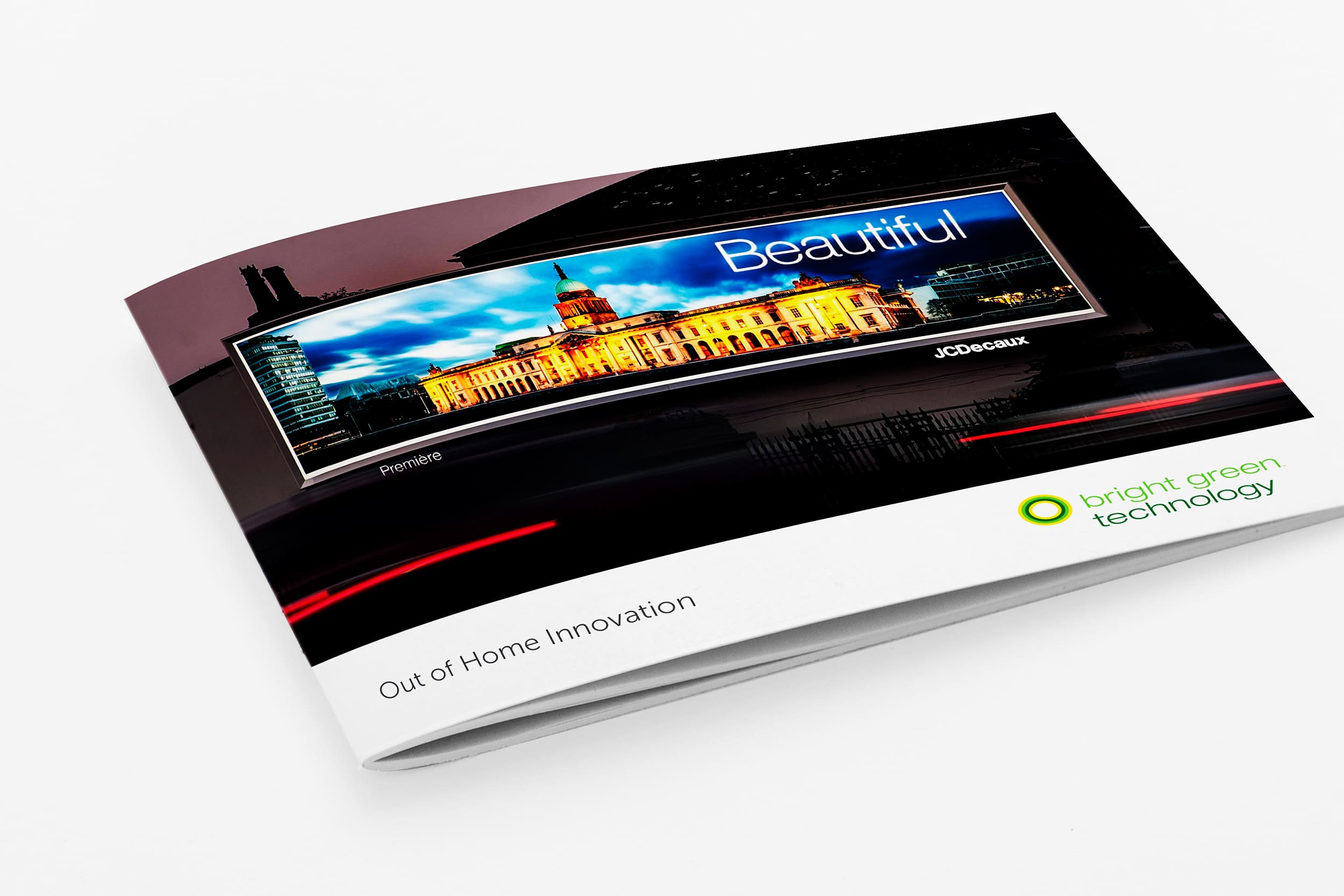 A brochure featuring a sleek design with a cover displaying a digital billboard showing a vibrant cityscape at night with the word "Beautiful." The brochure is titled "Out of Home Innovation" and has the logo and name "bright green technology" at the bottom right.