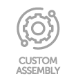 A gear and wrench icon representing custom assembly with "CUSTOM ASSEMBLY" written below it. The icon and text are in light gray against a green background.