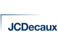 The image shows the JCDecaux logo. The logo consists of the text "JCDecaux" in a bold, blue font, positioned slightly to the right within a frame formed by a thin, blue line on the top and left sides.