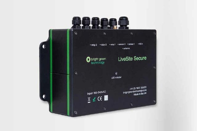 An anti-hacking security device titled "LiveSite Secure" by bright-green technology, featuring multiple ports on the top. The device has several labeled indicators and specifications on the front, including input voltage range, CE marking, and contact details. It is black with green accents.