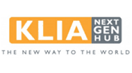 A logo with the text "KLIA Next Gen Hub" where "KLIA" is in bold white letters on an orange background, "Next Gen Hub" is in black letters on a gray background, and below, the slogan "THE NEW WAY TO THE WORLD" is written in gray uppercase letters.