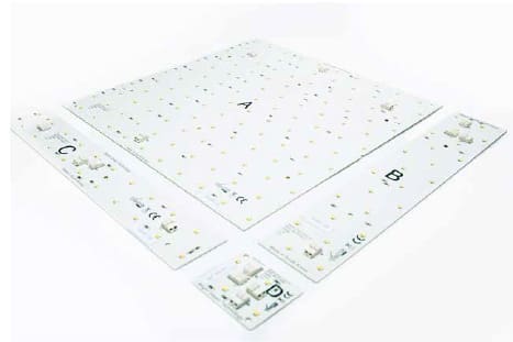 Four LED light panels labeled A, B, C, and D arranged on a flat surface. The panels vary in size, with A being the largest and perfectly square, and B, C, and D being smaller and rectangular. The panels have numerous tiny LEDs uniformly distributed across their surfaces.