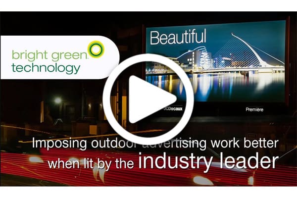 A video showing brightly lit outdoor advertisement promoting "bright green technology." The ad shows a large billboard with the word "Beautiful" and an image of a well-lit modern bridge at night. The text reads: "Imposing outdoor advertising work better when lit by the industry leader." A play button graphic is centered over the image.