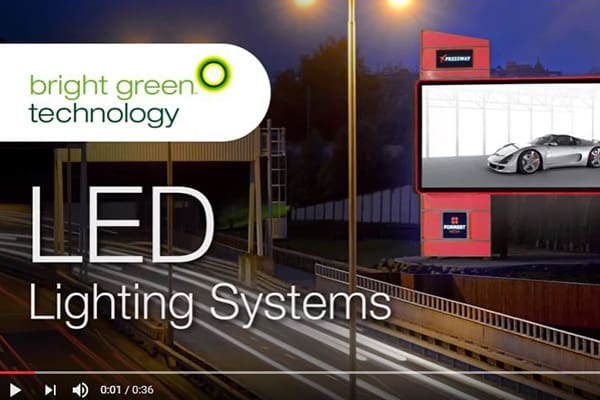 A promotional video for Bright Green Technology's LED Lighting Systems. It features a lit-up highway at night with an LED billboard displaying a luxury car. The Bright Green Technology logo is at the top left, with the text "LED Lighting Systems" prominently below.